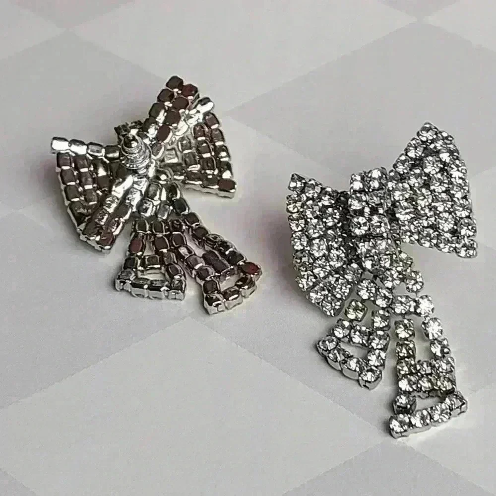 Silver tone clear rhinestones bow earrings - Picture 4 of 17